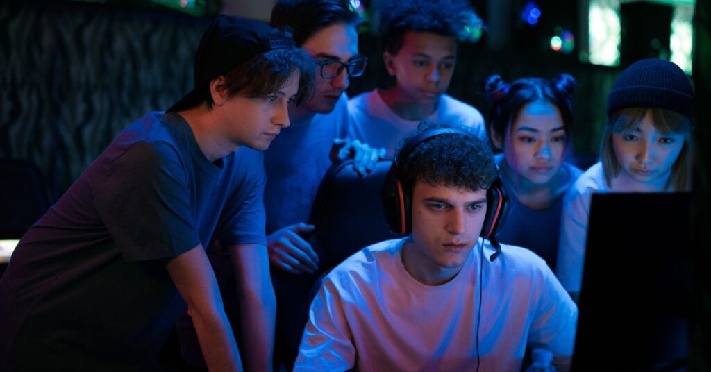 ProjectRethink org team esports players collaborating during an intense gaming session in a modern esports arena.